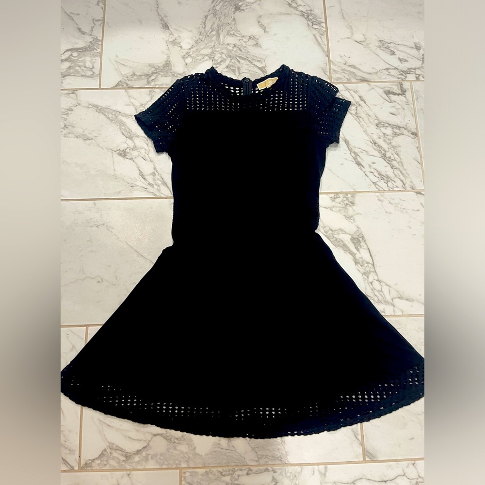 Michael Kors LBD with incredible circle cutouts with the perfect shape.